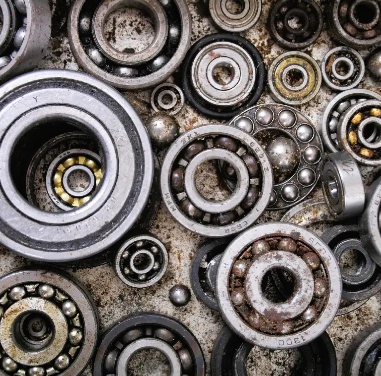 A bunch of different types of bearings on the ground